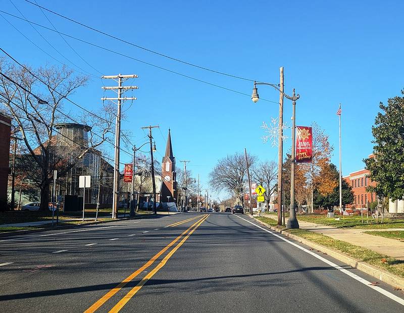 Washington Street in downtown Toms River, with a church steeple and county buildings