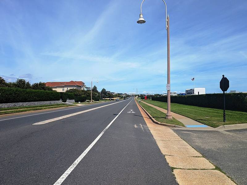 Ocean Avenue in Deal, New Jersey, lined with hedges and large homes