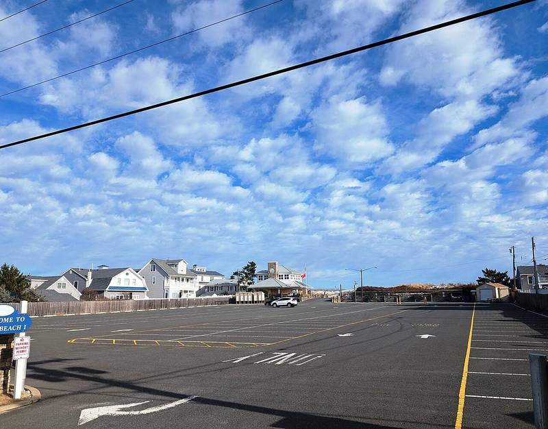 The entrance and parking lot of Brick Beach I on Route 35